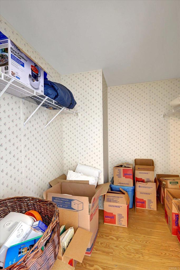 205 Mockingbird Lane Oceanside, CA 92057 - Photo 21 of 28 a bedroom with a bed and a shelf