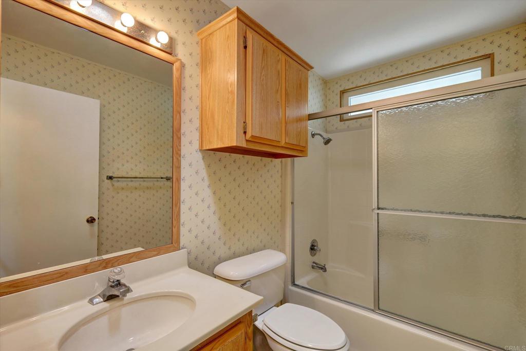 205 Mockingbird Lane Oceanside, CA 92057 - Photo 28 of 28 a bathroom with a sink toilet and shower