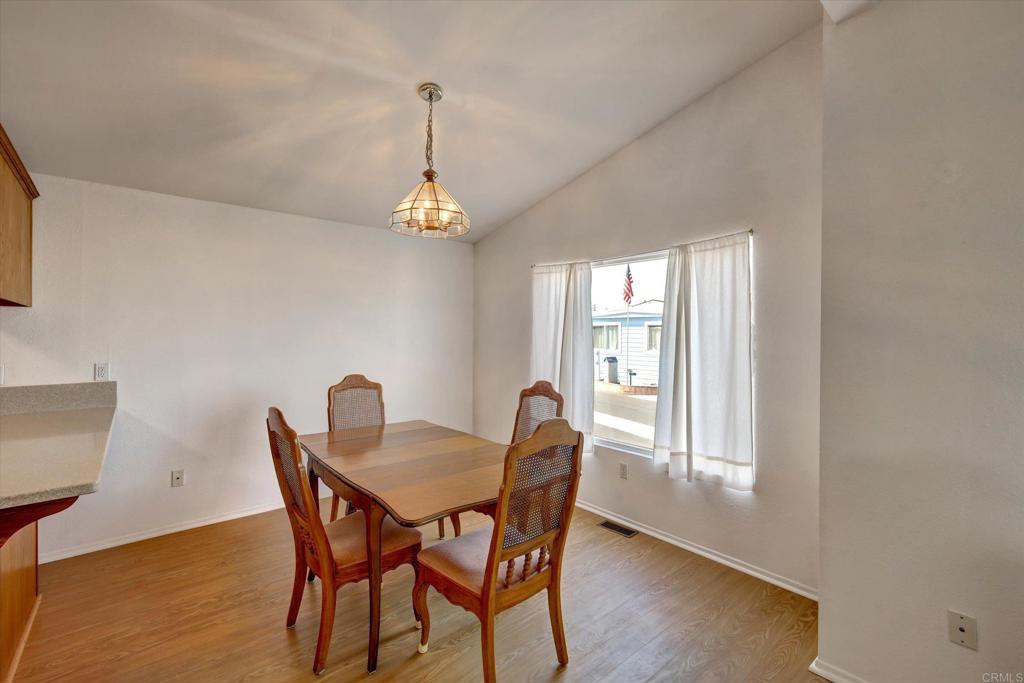 205 Mockingbird Lane Oceanside, CA 92057 - Photo 6 of 28 a view of a dining room with furniture window and wooden floor