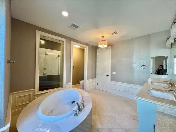 a bathroom with a bathtub and a sink