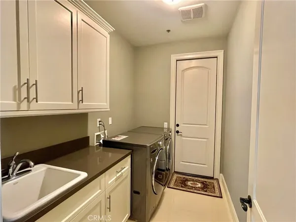 a bathroom with a sink and a washing machine