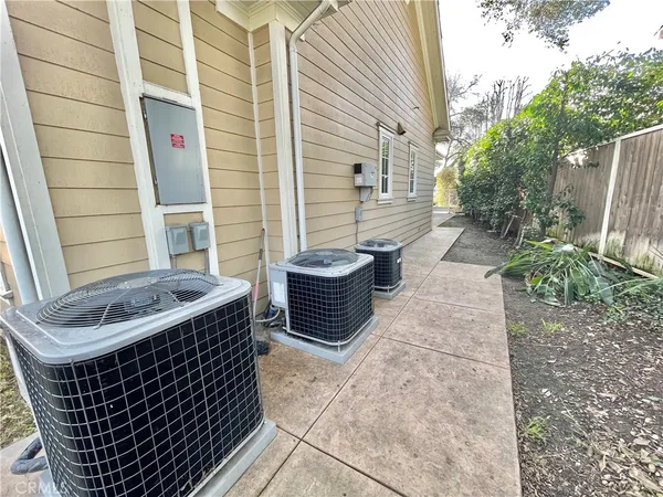 a view of a patio with table and chairs