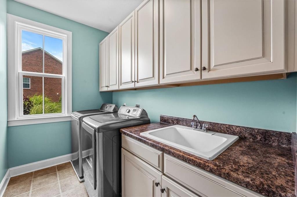 205 Taylor Ridge Lane Mars, PA 16046 - Photo 23 of 50 a utility room with stainless steel appliances granite countertop a sink window and cabinets