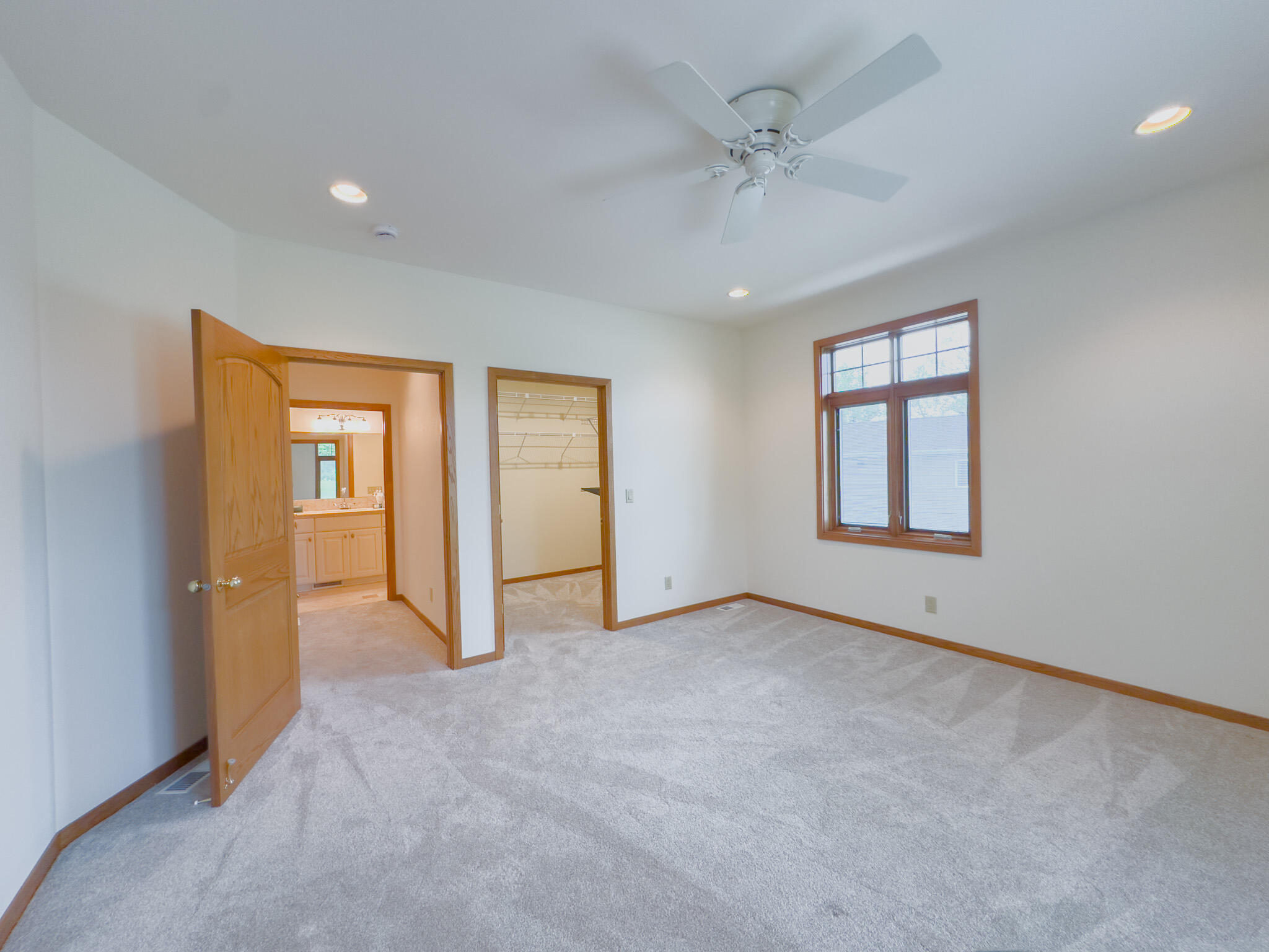 11604 North Granville Road Mequon, WI 53097 - Photo 28 of 49 Walk in closet, ceiling fan and newer carpet.