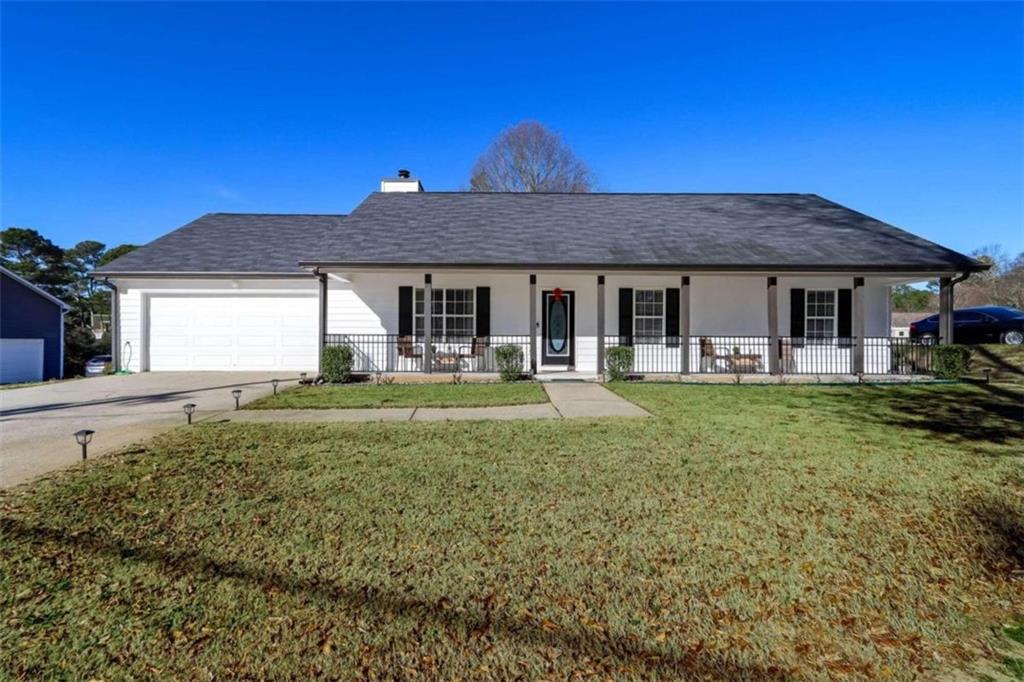 408 Bee Maxey Road Winder, GA 30680 - Photo 1 of 1 a front view of a house with garden