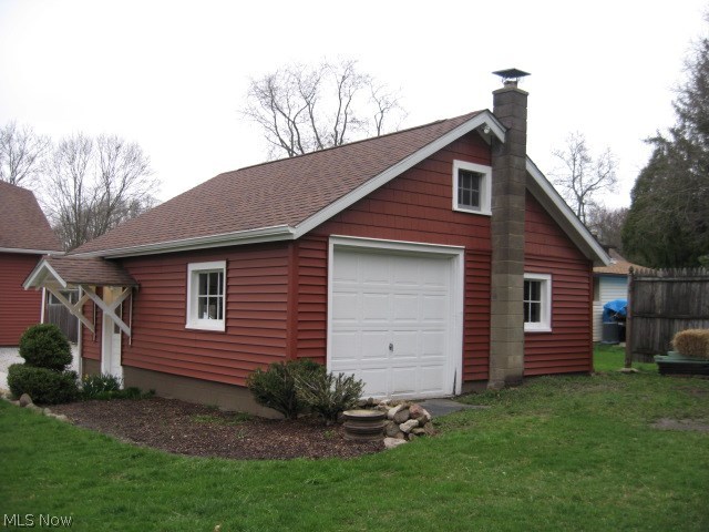 1657 Betz Road Akron, OH 44306 - Photo 19 of 34 BACK VIEW OF QUAINT TWO PLUS CAR GARAGE - - WORK BENCH - - PULL DOWN STAIRS TO UPPER LEVEL FOR ADDITIONAL STORAGE - - - - - - - NEWER GARAGE DOOR IN BACK OF GARAGE WITH ACCESS TO BACKYARD