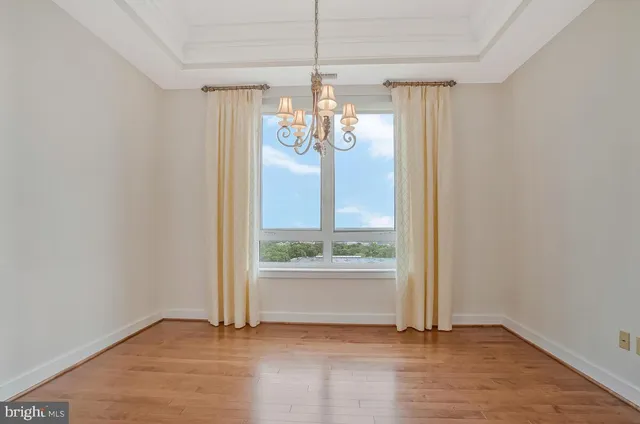 a view of a room with wooden floor outdoor view and window