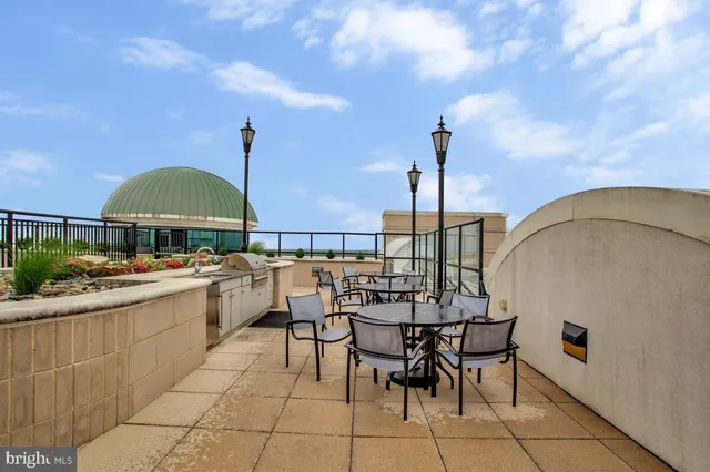 a view of a swimming pool with a table and chairs