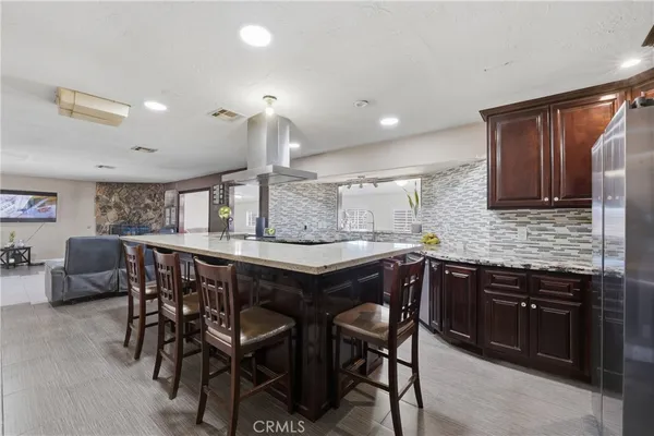 a kitchen with a table and chairs in it
