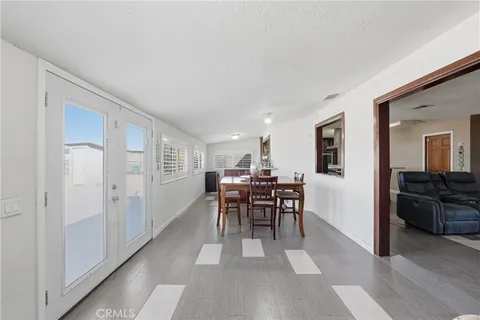 a view of a livingroom with furniture and a window