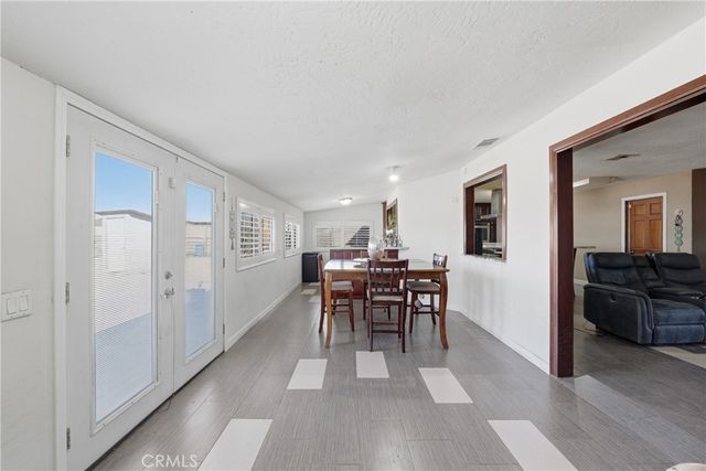 a view of a livingroom with furniture and a window