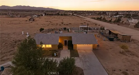 a view of a city with mountains in the background