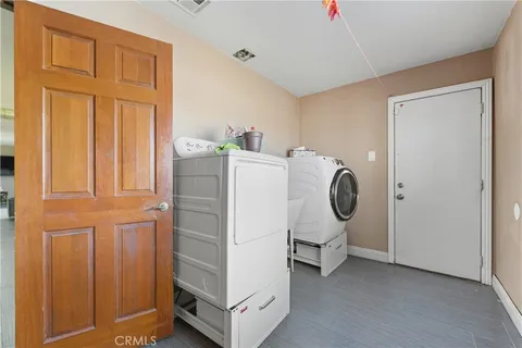 a utility room with closet dryer and washer