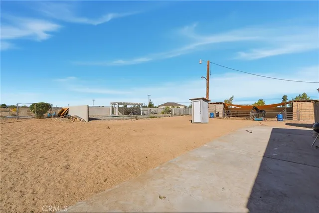a view of a swimming pool with outdoor seating and city view