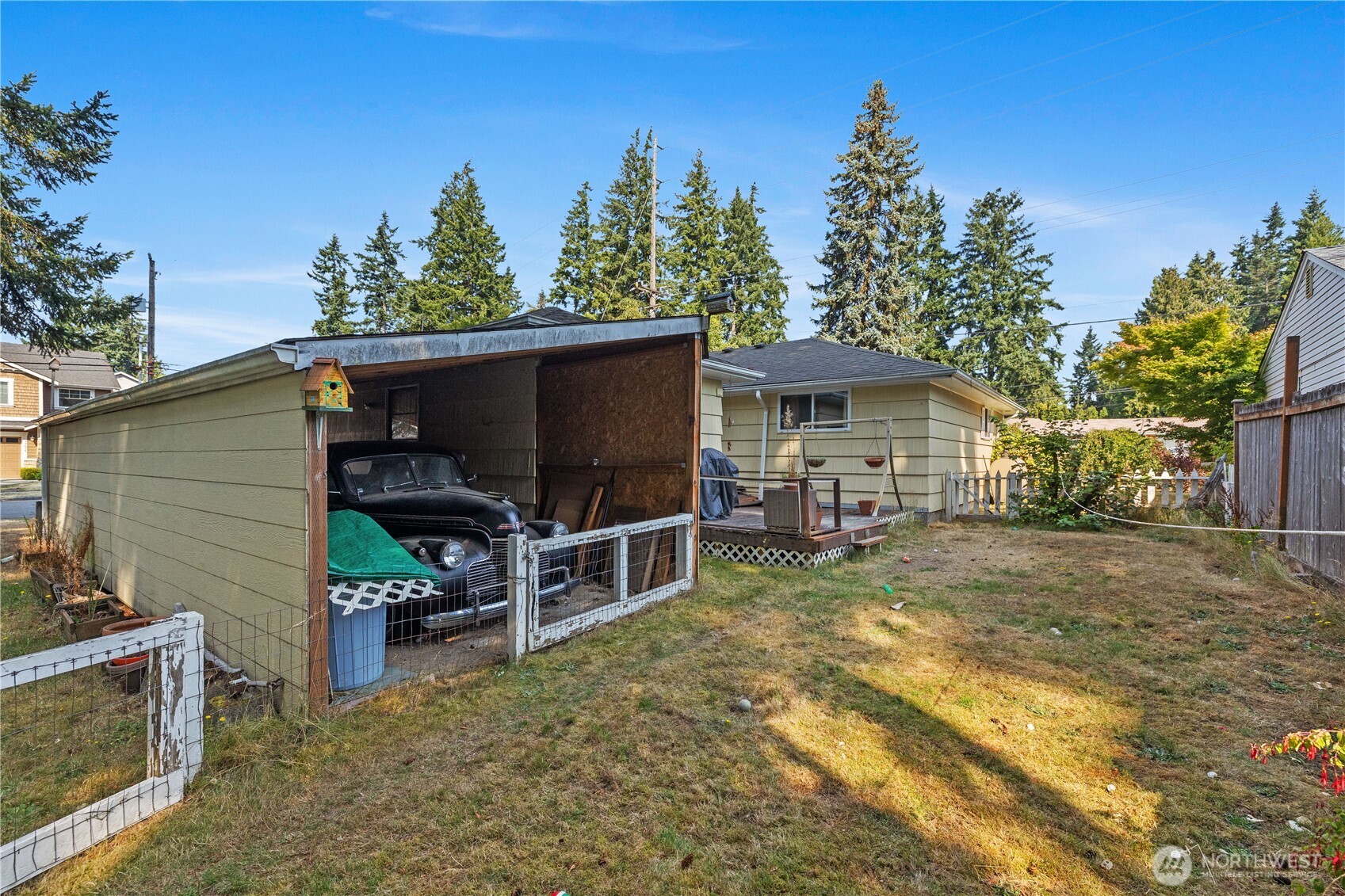 105 Northeast 180th Street Shoreline, WA 98155 - Photo 21 of 34 a view of a house with backyard and sitting area