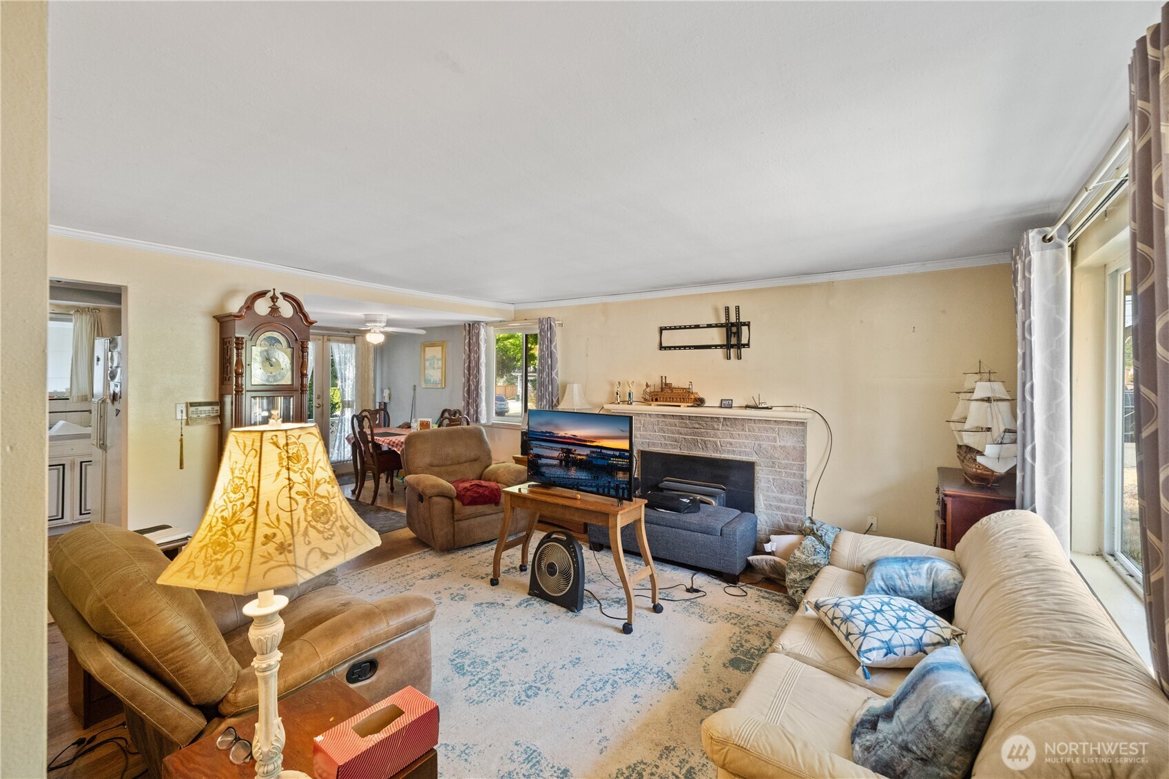105 Northeast 180th Street Shoreline, WA 98155 - Photo 8 of 34 a living room with furniture fireplace and a flat screen tv