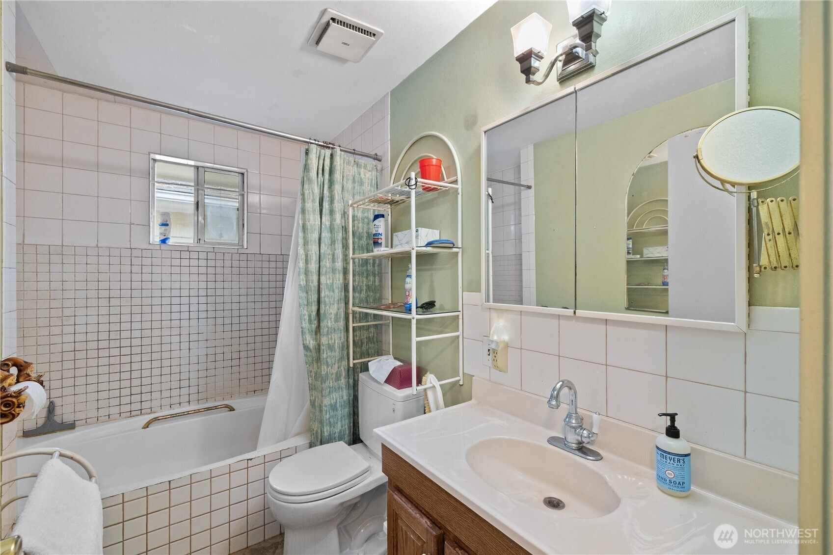 105 Northeast 180th Street Shoreline, WA 98155 - Photo 10 of 34 a bathroom with a sink a toilet and shower