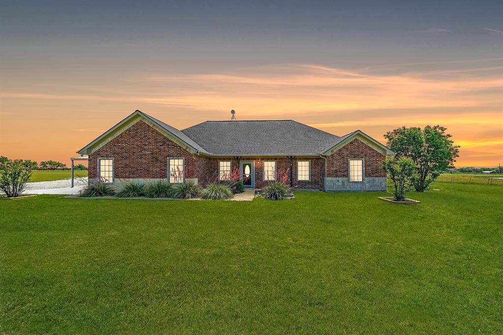 7530 Barthold Road Denton, TX 76207 - Photo 1 of 1 View of front of property featuring brick siding, a lawn, and roof with shingles
