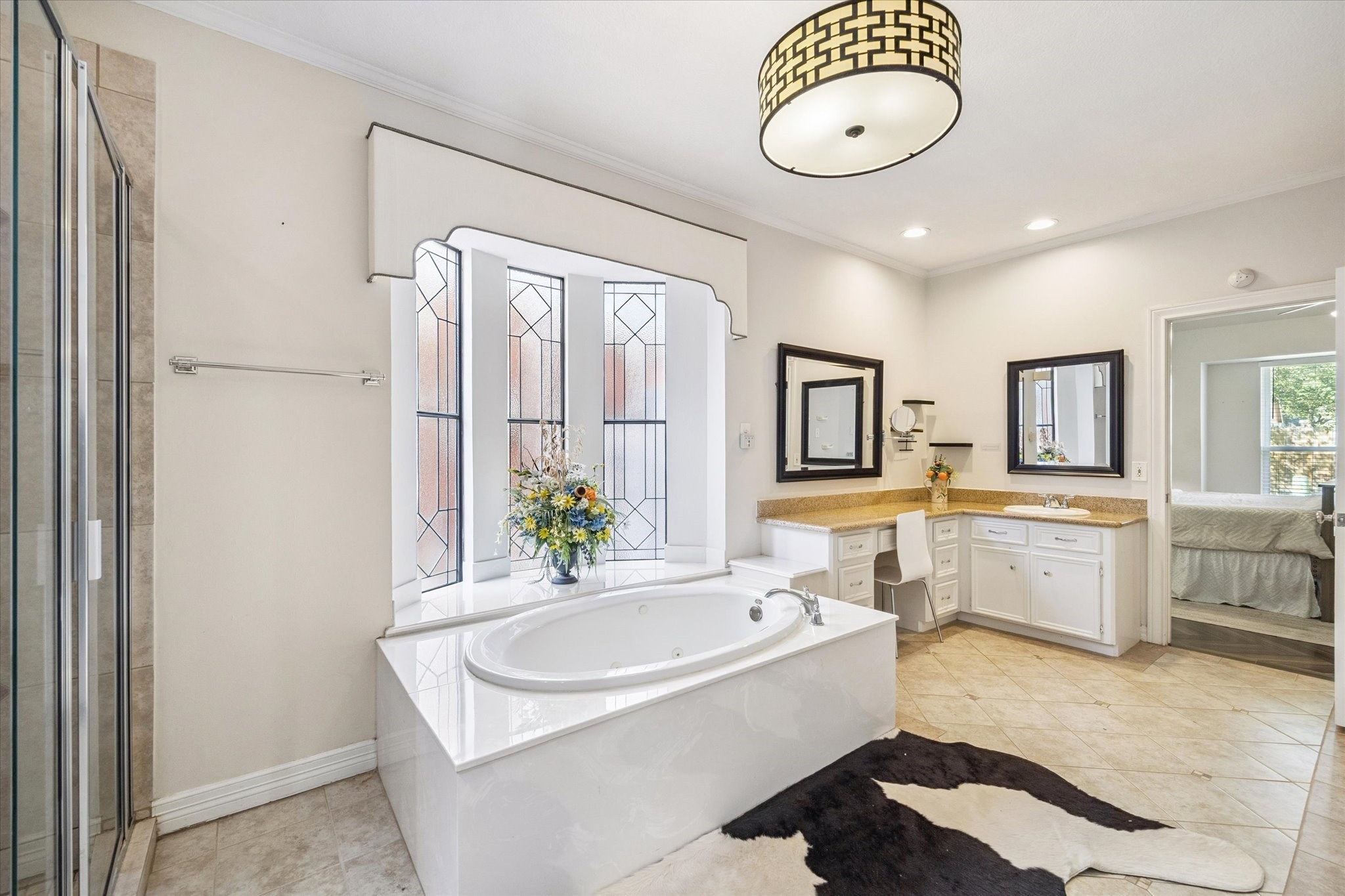1118 Sherfield Ridge Drive Katy, TX 77450 - Photo 19 of 33 a bathroom with a granite countertop sink mirror and bathtub