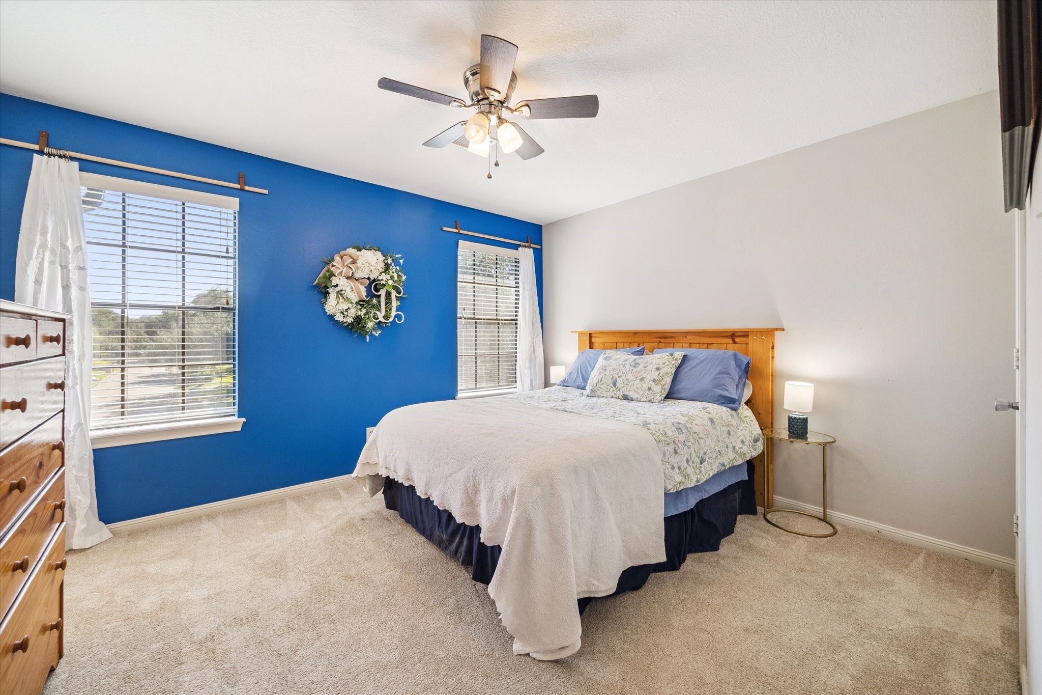 1118 Sherfield Ridge Drive Katy, TX 77450 - Photo 27 of 33 a bed sitting in a bedroom next to a window