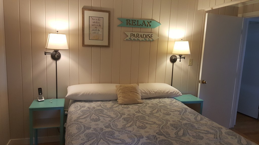 206 Cadmans Neck Road, Unit VAC RENTAL Westport, MA 02790 - Photo 12 of 24 a bedroom with a bed and a window