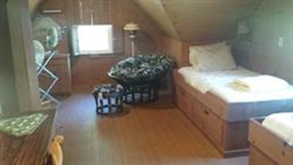 206 Cadmans Neck Road, Unit VAC RENTAL Westport, MA 02790 - Photo 15 of 24 a room with furniture and a chandelier