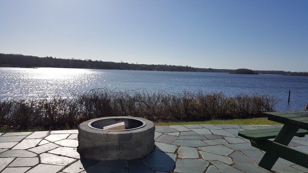 206 Cadmans Neck Road, Unit VAC RENTAL Westport, MA 02790 - Photo 19 of 24 a view of a couches and a table in the patio