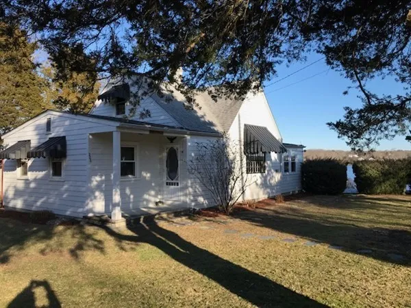 a view of a house with large tree
