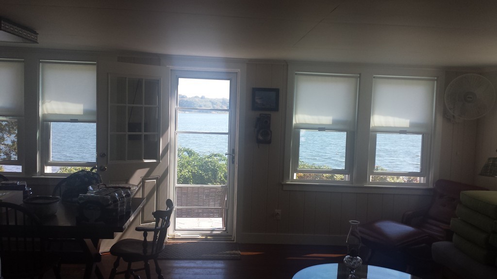 206 Cadmans Neck Road, Unit VAC RENTAL Westport, MA 02790 - Photo 6 of 24 a view of a room with a window and wooden floor