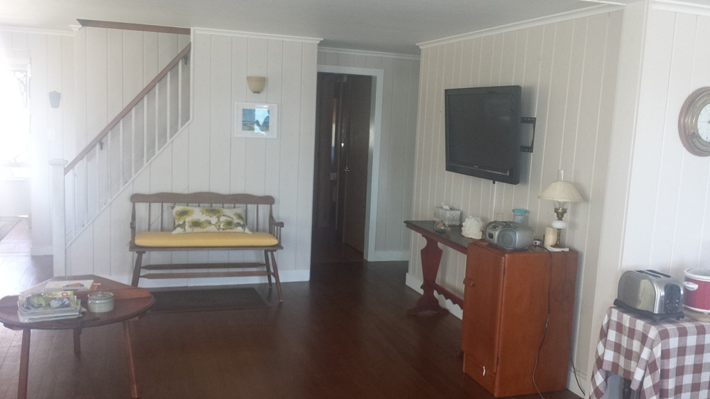 206 Cadmans Neck Road, Unit VAC RENTAL Westport, MA 02790 - Photo 8 of 24 a living room with furniture and a flat screen tv