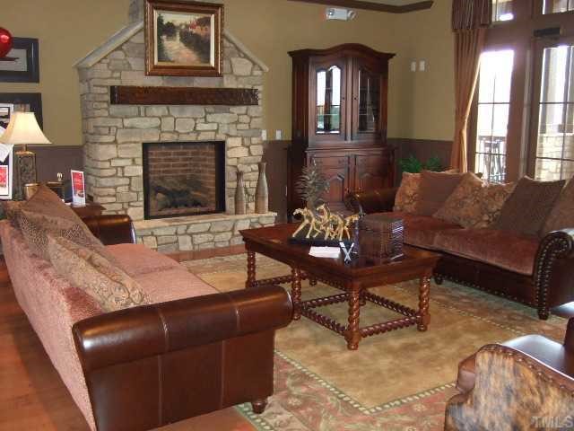 2932 Casona Way Raleigh, NC 27616 - Photo 7 of 12 a living room with furniture and a fireplace