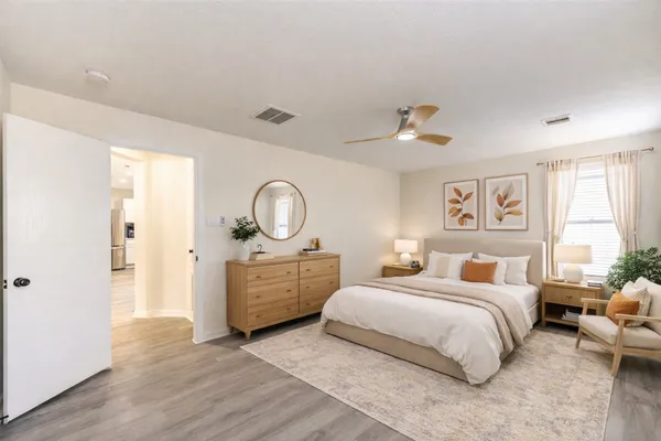 a bedroom with bed and a window