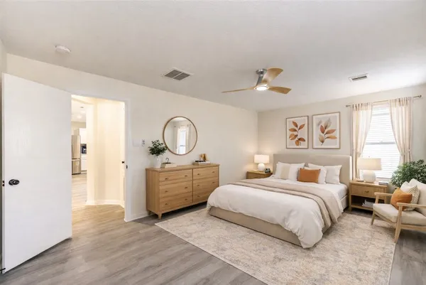 a bedroom with bed and a window