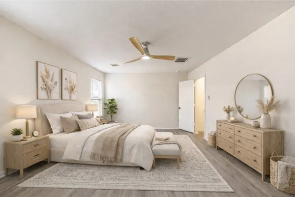 a bedroom with bed and a window