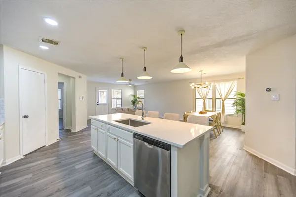 a kitchen with a stove and island