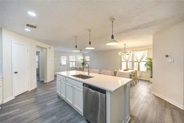 a kitchen with a stove and island