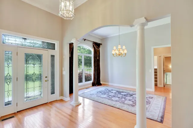a view of an entryway with wooden floor