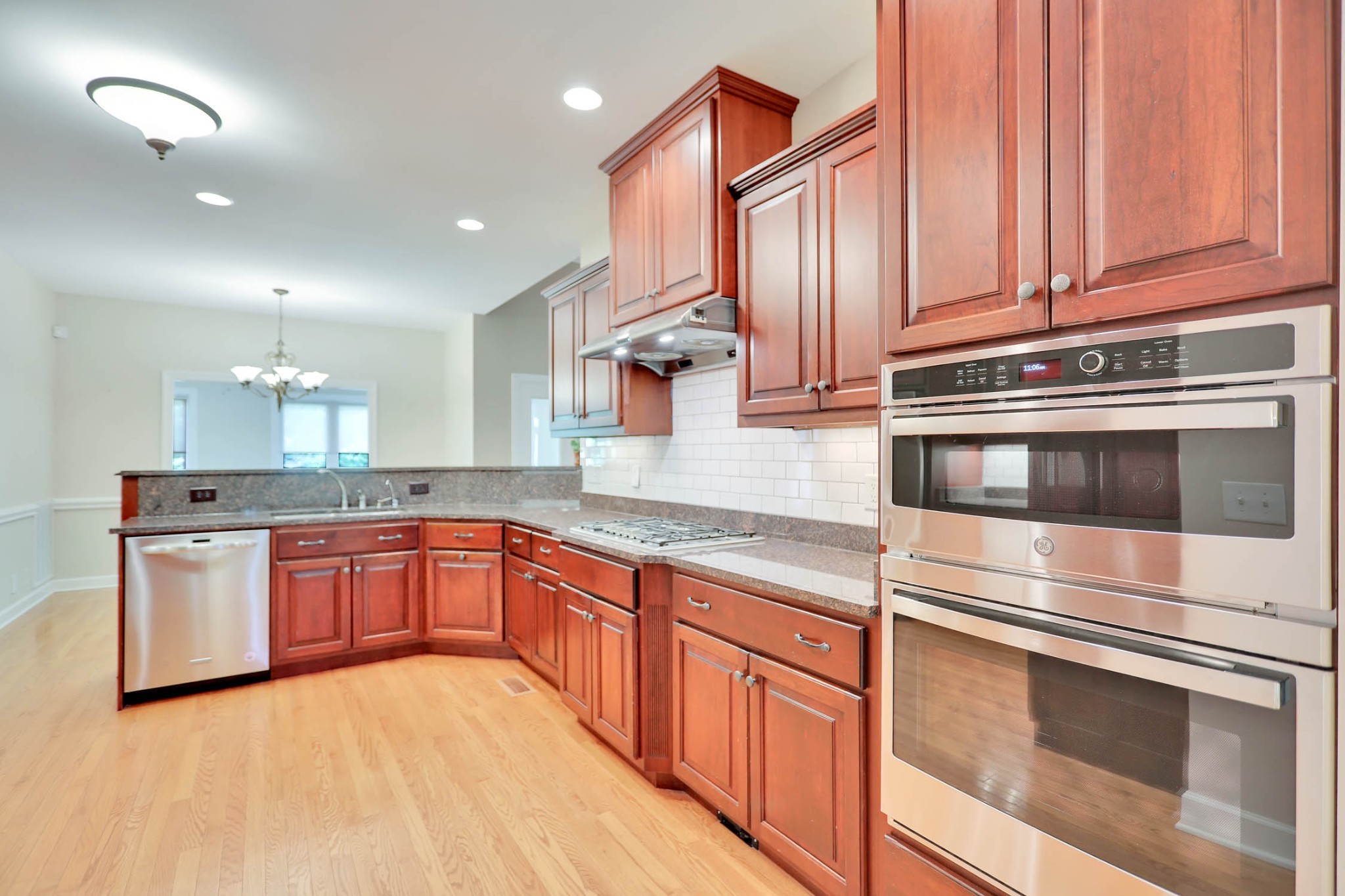 358 Spring Valley Drive Cottontown, TN 37048 - Photo 25 of 67 a kitchen with stainless steel appliances granite countertop a stove and a sink