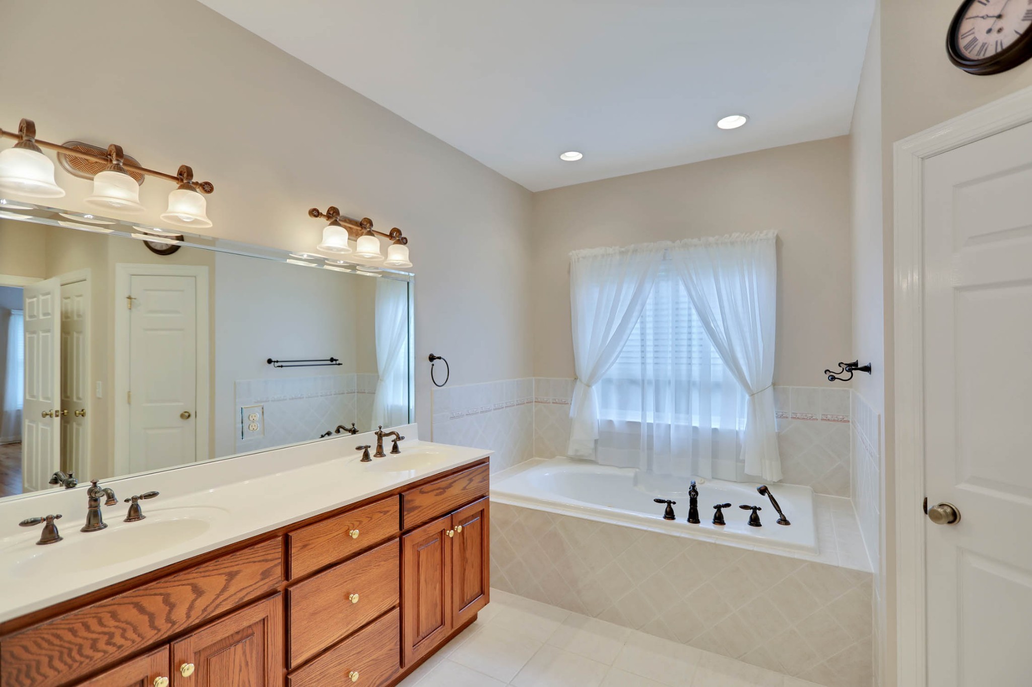358 Spring Valley Drive Cottontown, TN 37048 - Photo 28 of 67 a spacious bathroom with a tub sink and mirror