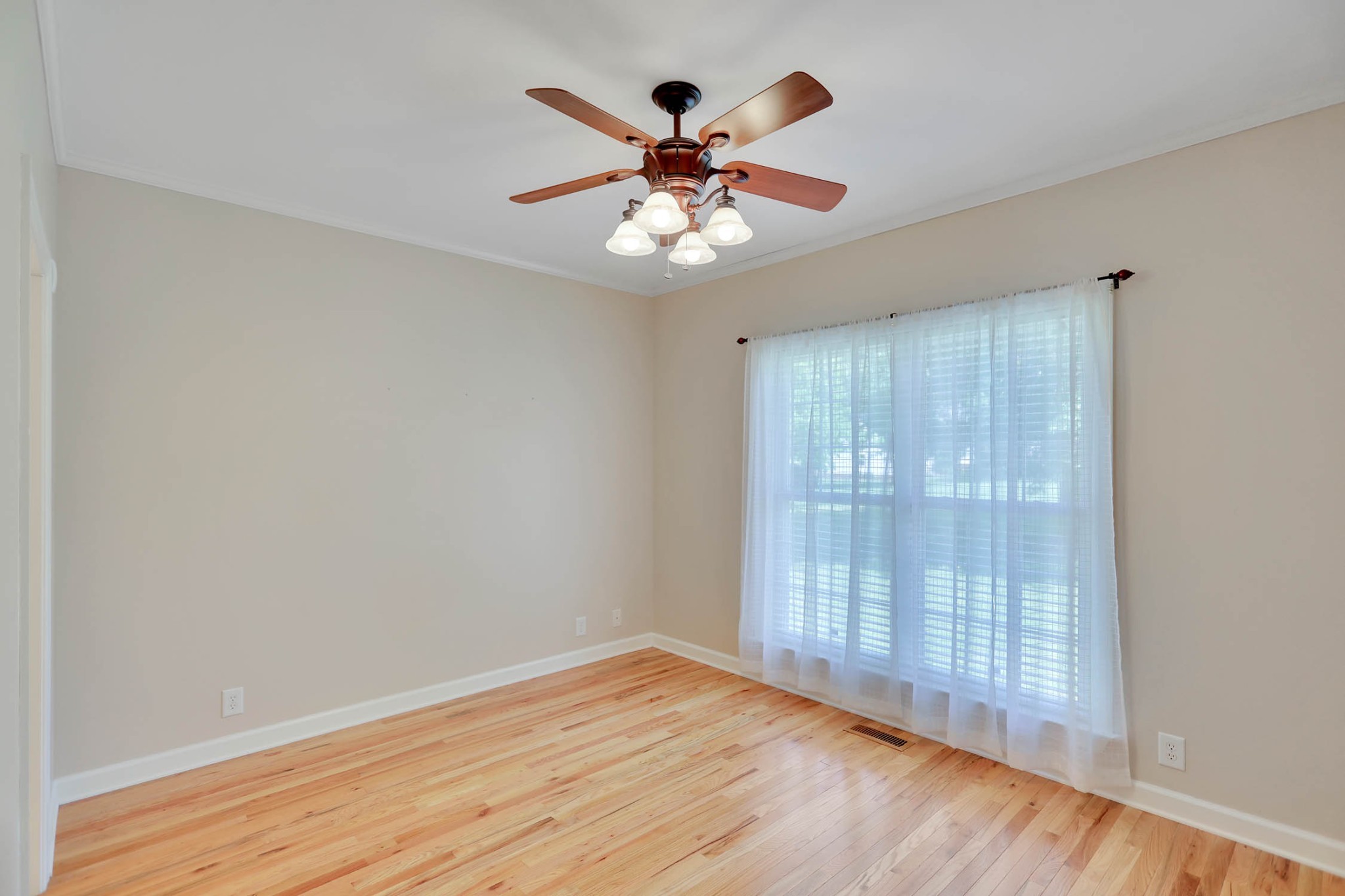 358 Spring Valley Drive Cottontown, TN 37048 - Photo 35 of 67 wooden floor in an empty room with a window