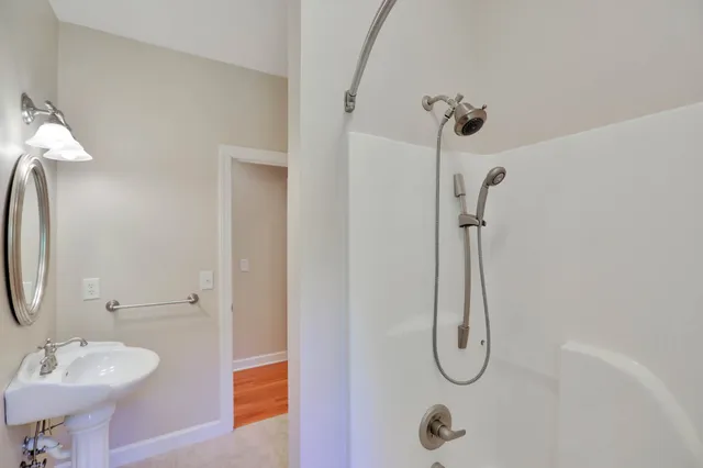 a view of a house with backyard and deck