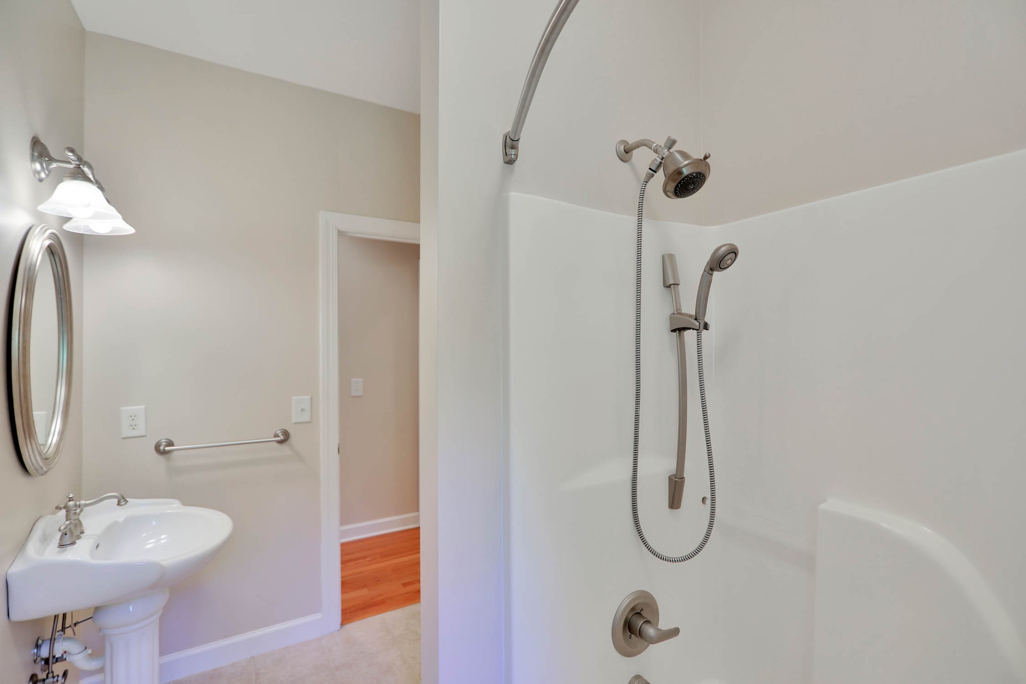 358 Spring Valley Drive Cottontown, TN 37048 - Photo 38 of 67 a bathroom with a granite countertop shower sink vanity and mirror