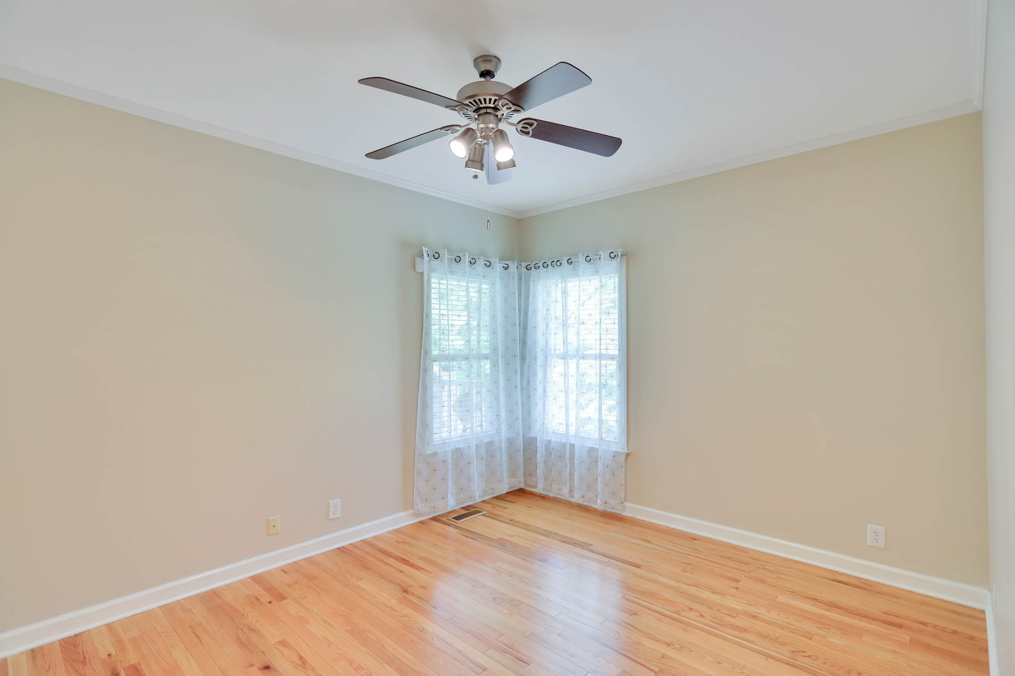 358 Spring Valley Drive Cottontown, TN 37048 - Photo 40 of 67 an empty room with wooden floor fan and windows