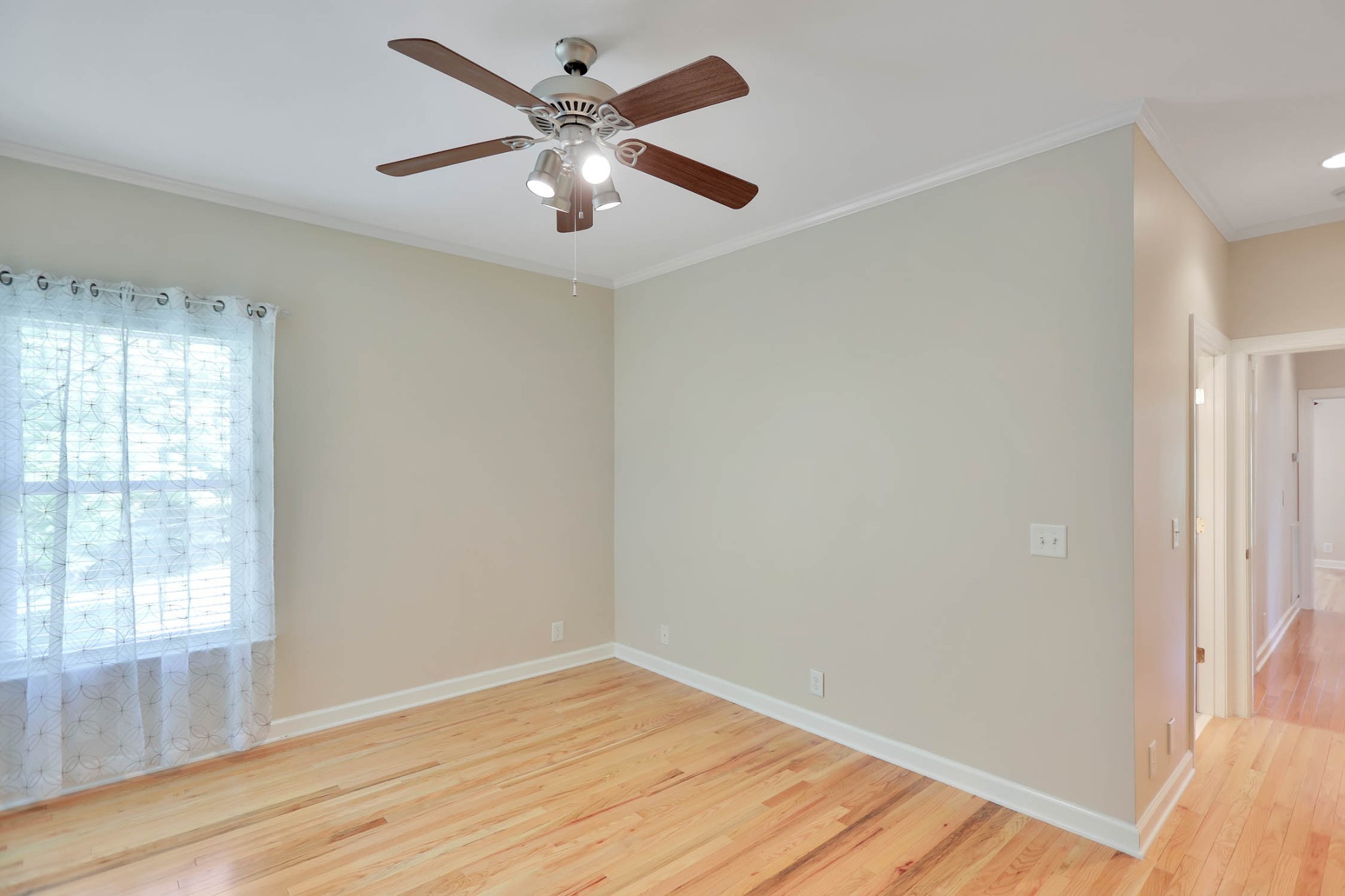 358 Spring Valley Drive Cottontown, TN 37048 - Photo 41 of 67 an empty room with wooden floor and windows