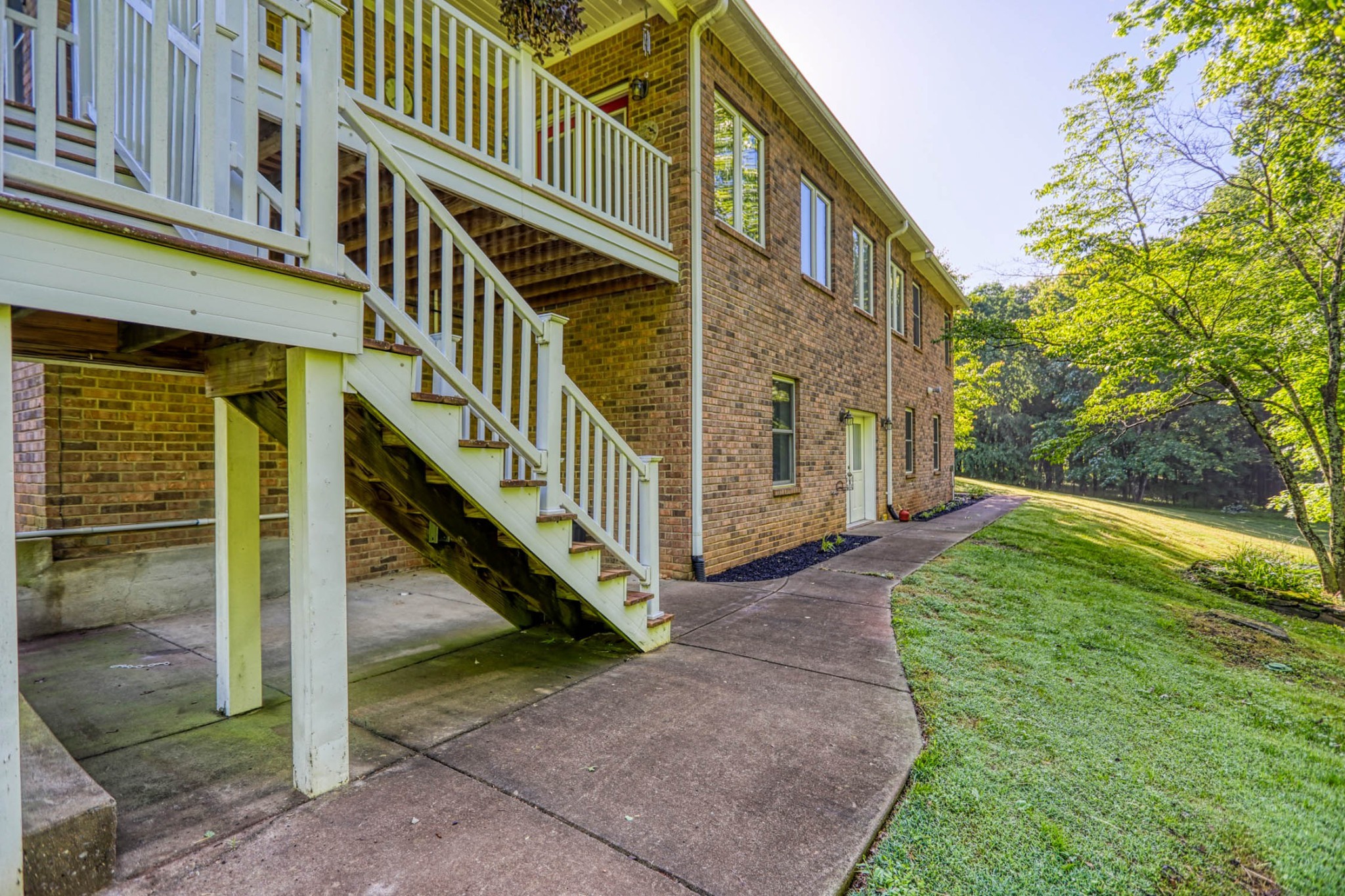 358 Spring Valley Drive Cottontown, TN 37048 - Photo 53 of 67 a view of a house with backyard and deck