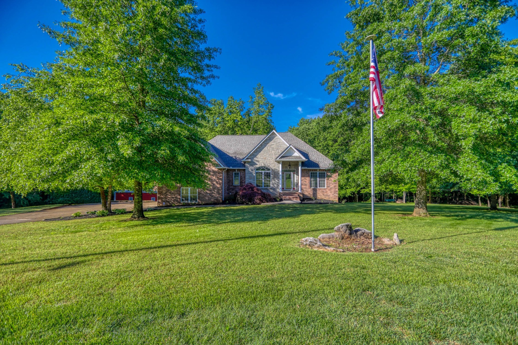 358 Spring Valley Drive Cottontown, TN 37048 - Photo 59 of 67 a front view of a house with a yard and green space
