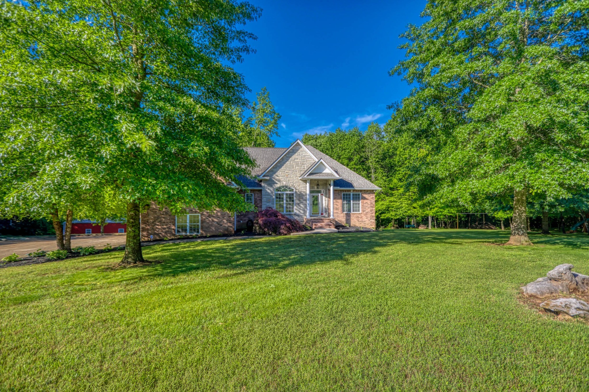 358 Spring Valley Drive Cottontown, TN 37048 - Photo 60 of 67 a front view of a house with garden
