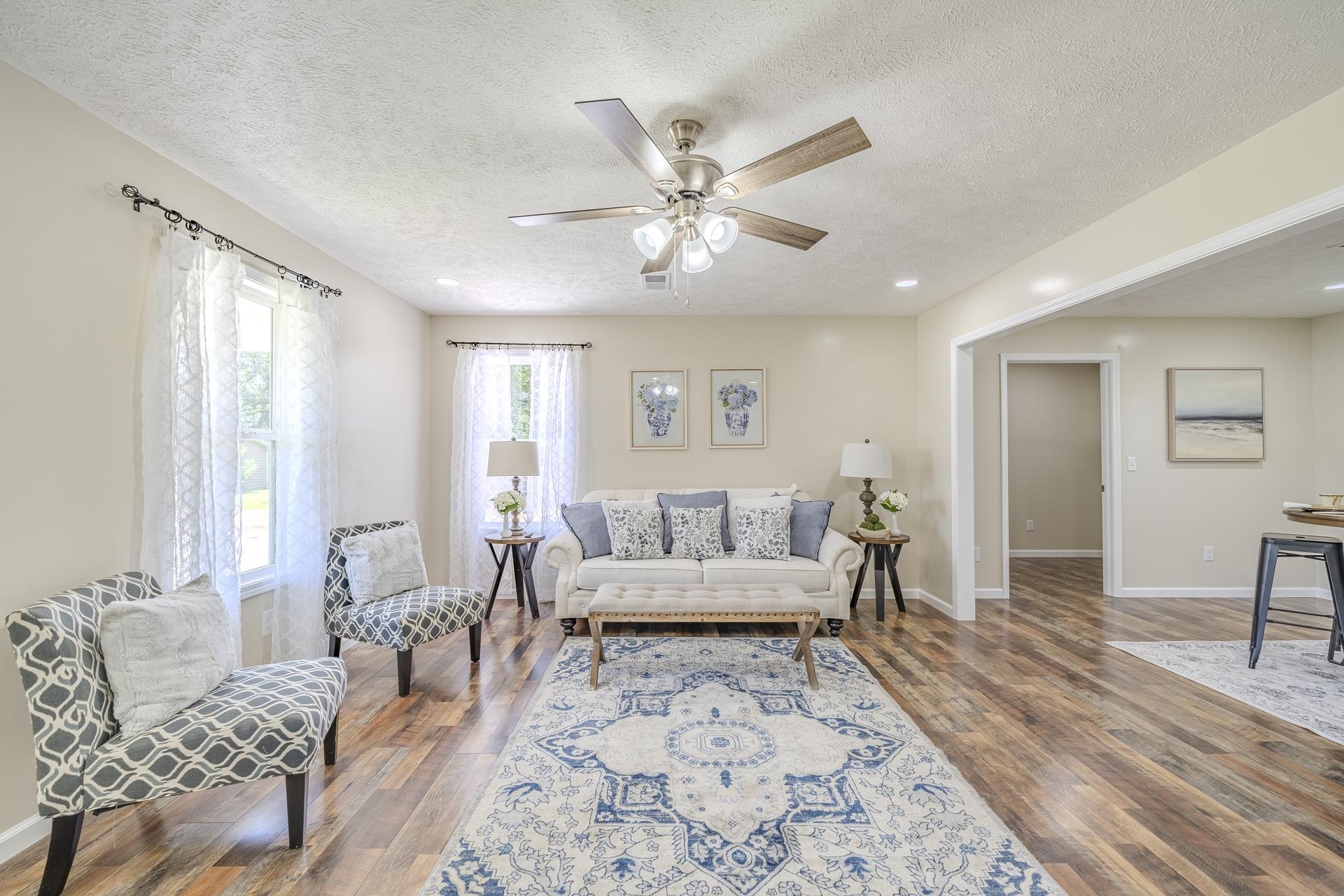 231 Clausel Lane Adamsville, TN 38310 - Photo 2 of 32 a living room with furniture and a large window