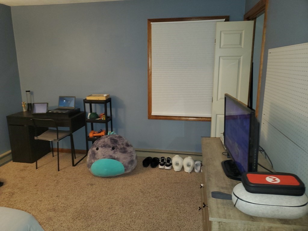 149 Dale Street, Unit S Chicopee, MA 01020 - Photo 17 of 21 a living room with furniture and a lamp