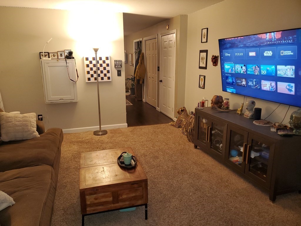 149 Dale Street, Unit S Chicopee, MA 01020 - Photo 6 of 21 a bed room with a bed and a television